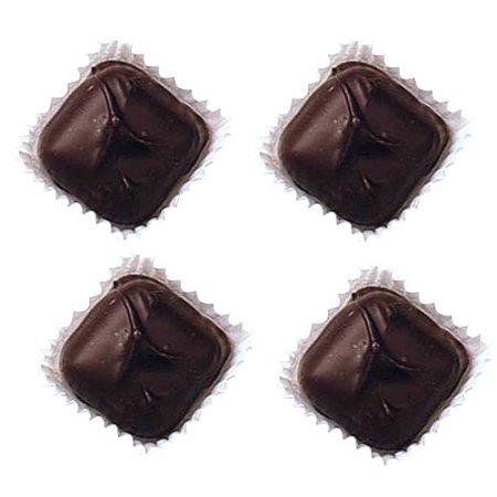 four square-shaped Asher dark chocolate caramels candies, each placed in a white paper wrapper, arranged neatly on a white background.