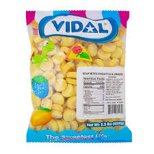 Vidal Sour Bits Pineapple & Orange candy in a bright, colorful 2.2 pound bulk bag with yellow gummy candies.